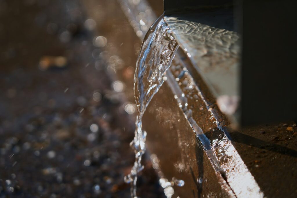 Water spraying from a burst pipe