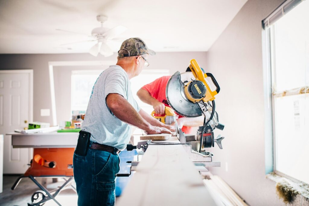 Contractor cutting materials during home reconstruction